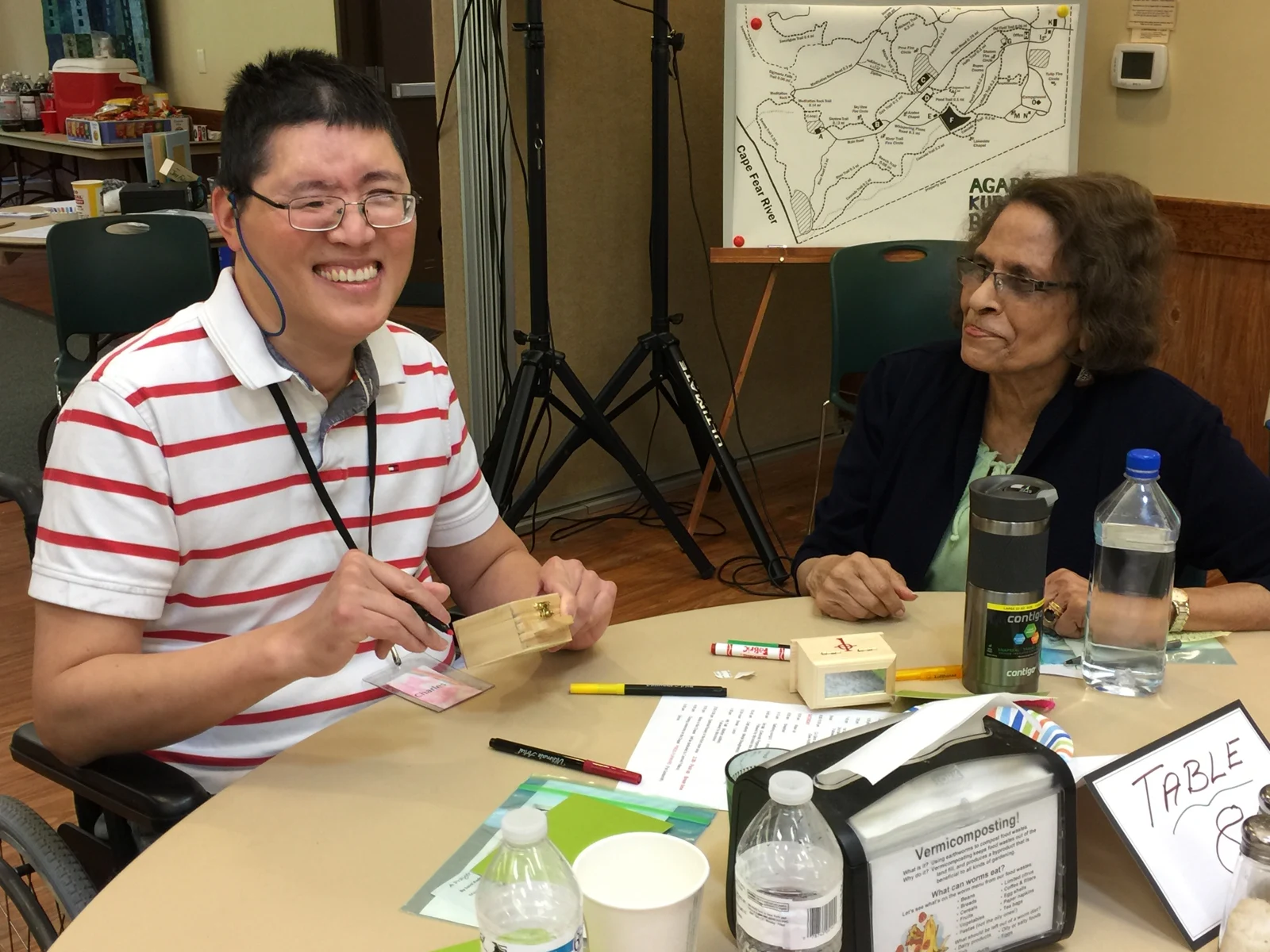 Friends sharing a smile at a past HEC gathering